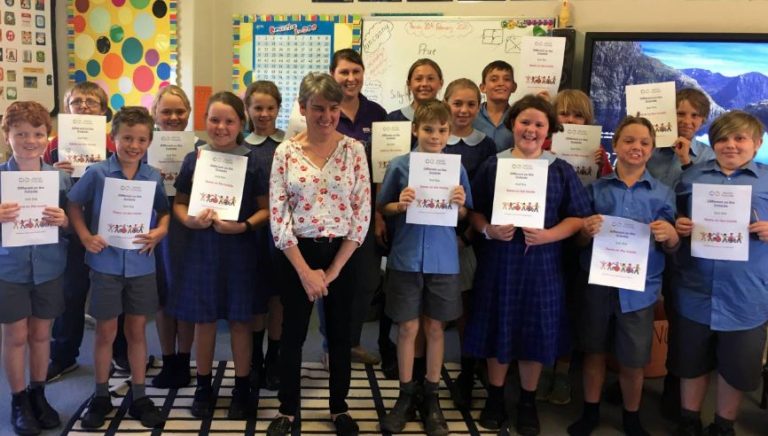 Different on the Outside, Same on the Inside facilitator, Prue, smiling with school kids