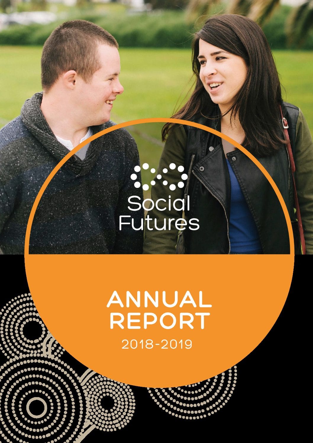 2018-19 Annual Report front cover, featuring a man and woman walking and smiling together on green grass.