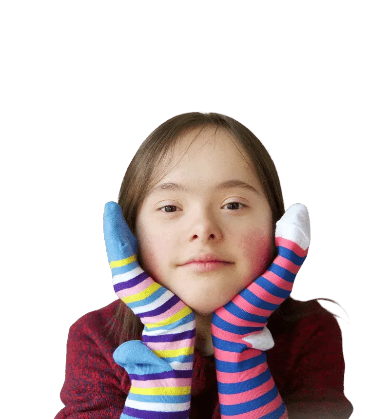 cute female child with socks on her hands