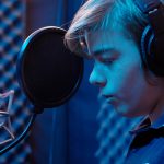 student recording a song
