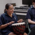 Student playing drum