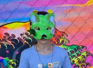 Child wearing mask as part of Queer Family Sprouts program