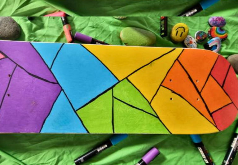 Rainbow painted skateboard from Queer Family Sprouts program