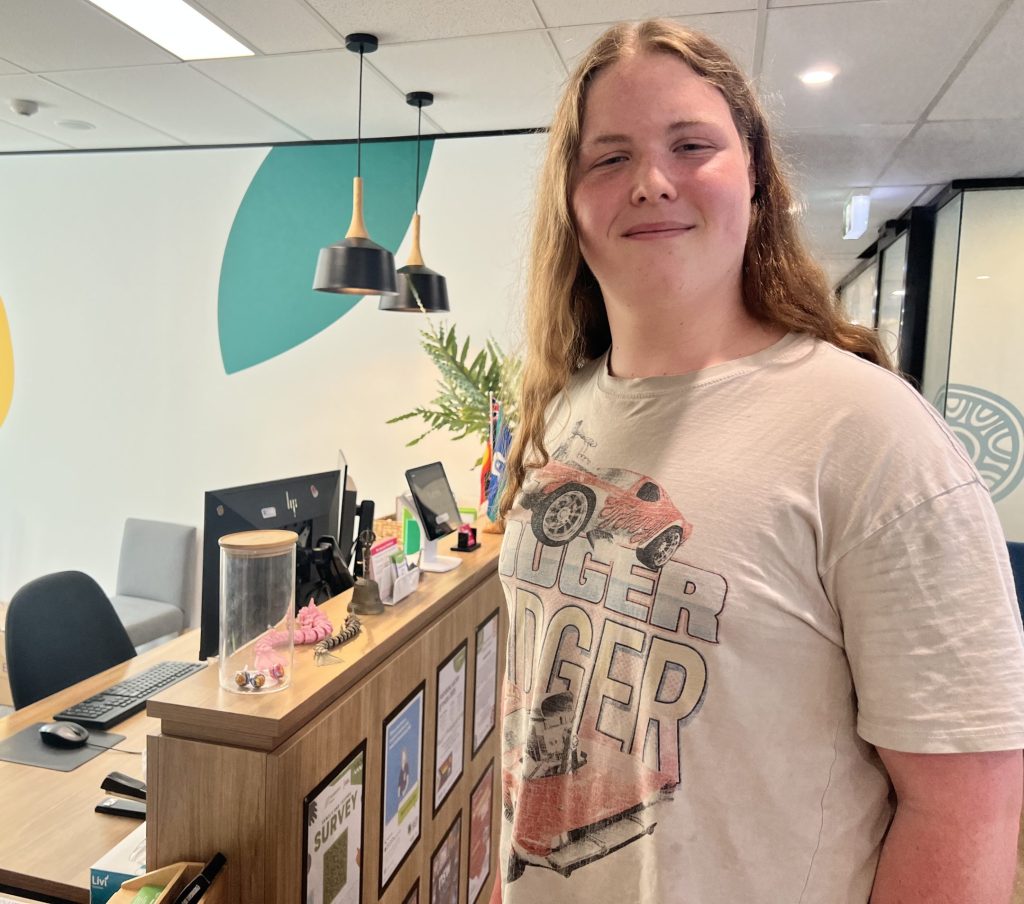 Leon stands in the headspace reception area