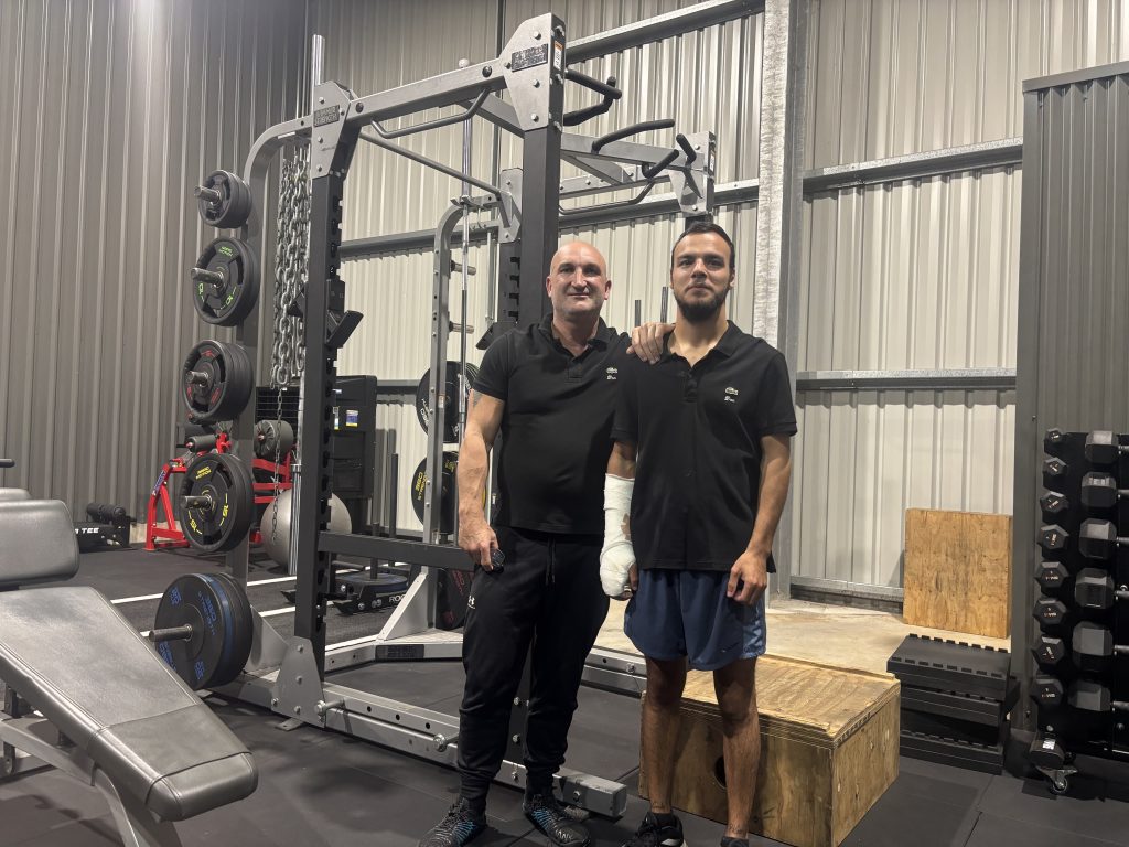 Jesse and his support worker at the gym
