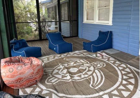 shows bean bags and a mat in a lovely veranda room at Ballina headspace
