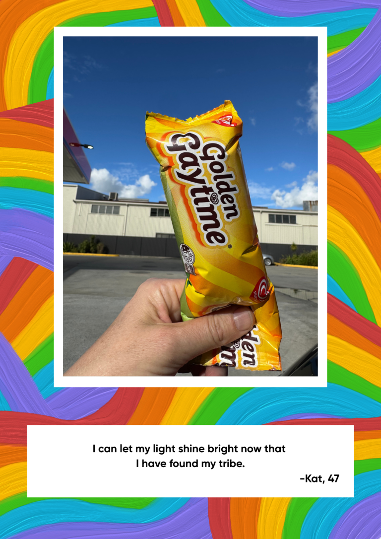 A hand holds up a Golden Gaytime icecream