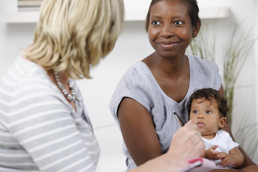 African American Woman And Baby Being Assessed